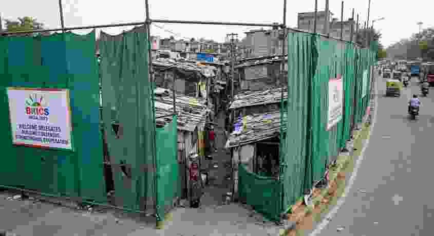 BRICS Summit Makeover Delhi Slums Hidden Behind Curtains